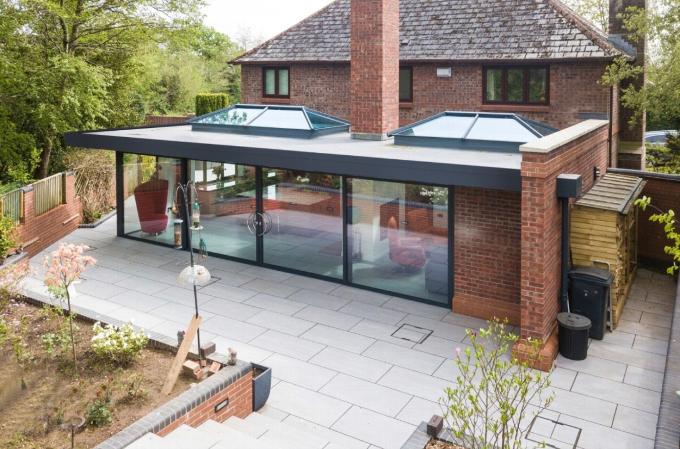 a house extension with a full length glass window